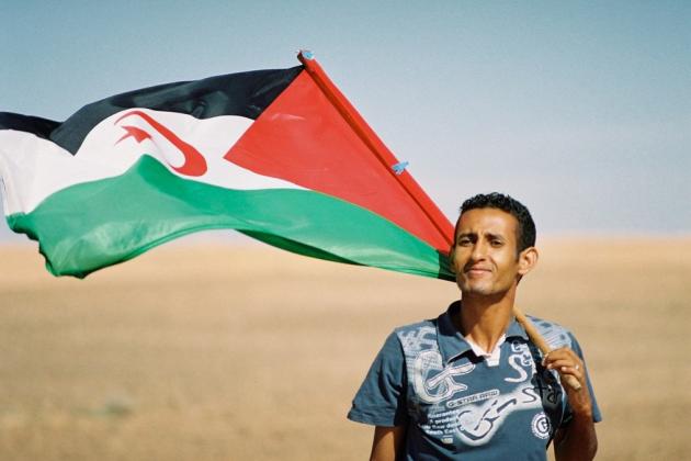 Man with Saharawi flag. Credit: Michele Benericetti