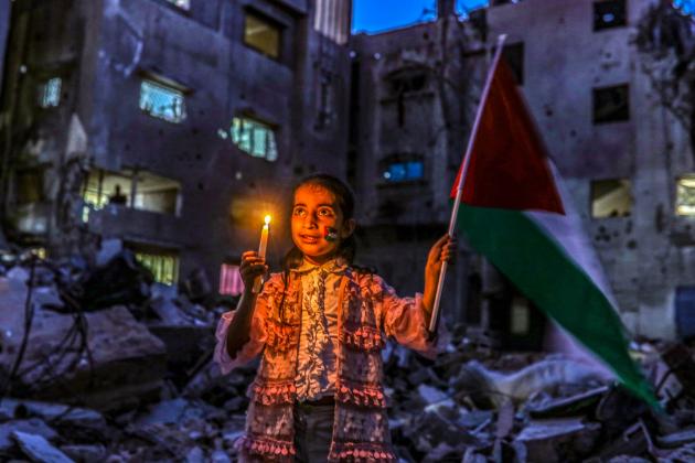 Palestinian girl at vigil in Gaza