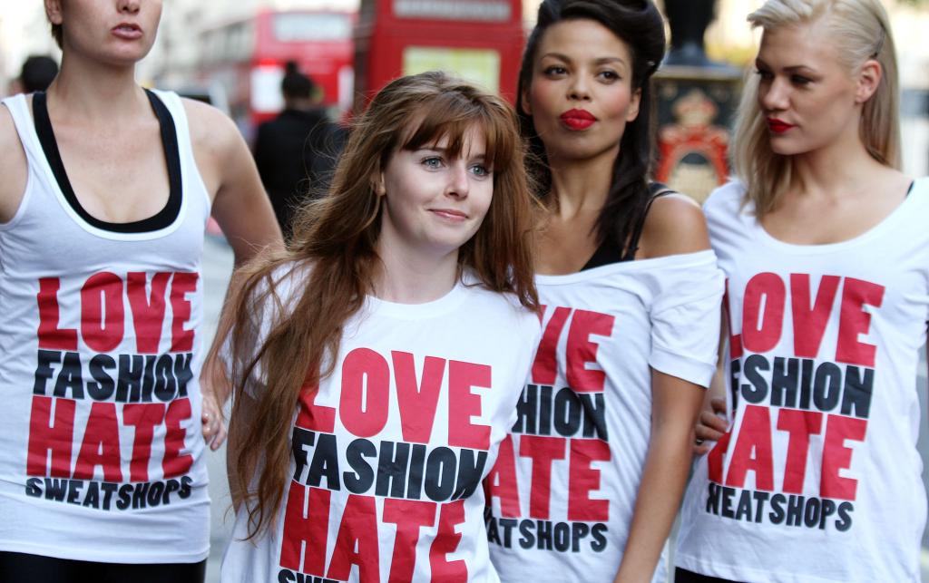 Models and Stacey Dooley campaign against sweatshops at London Fashion Week 2009, wearing 'Love Fashion, Hate Sweatshops' t-shirts.