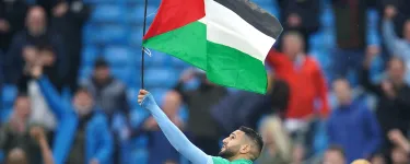 Manchester City's Riyad Mahrez with a Palestine flag