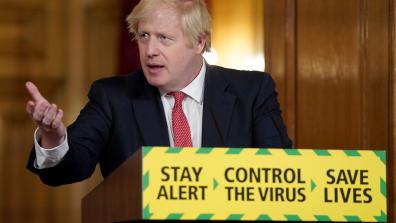 Prime Minister Boris Johnson holds the Daily Covid-19 Digital Press Conference, gesturing and standing in front of a lectern with the government slogan on the front: "Stay alert > Control the virus > Save lives". Photo: Pippa Fowles / No 10 Downing Street.
